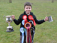 Jack with the rosettes and trophies at the Newfoundland Club Open Show 2010